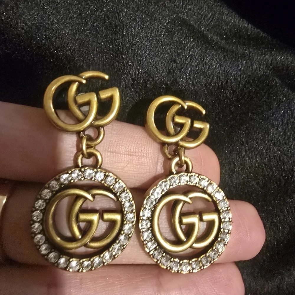 Gucci 18kgp Gucci Gold and Silver Crystal Logo Earrings